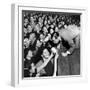 Comedian Milton Berle Trying to Kiss Fans Who Are Asking for Autographs-George Silk-Framed Premium Photographic Print