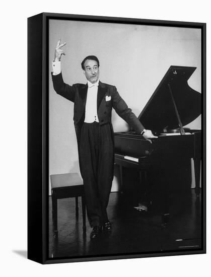 Comedian Pianist Victor Borge, in White Tie and Tails, Standing at Piano and Making Funny Faces-Peter Stackpole-Framed Stretched Canvas