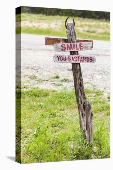 Comfort, Texas, USA. Humorous sign in the Texas Hill Country.-Emily Wilson-Stretched Canvas