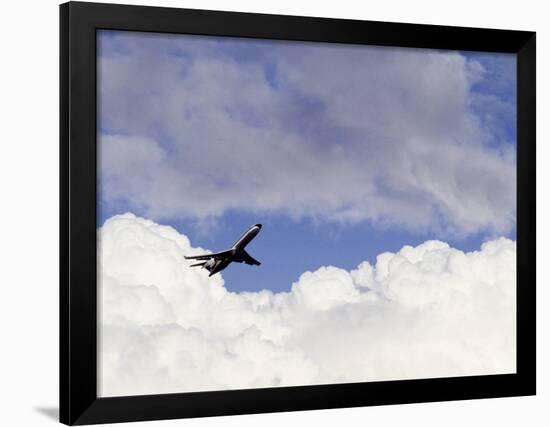 Commercial Airplane Soaring Above the Clouds-Mitch Diamond-Framed Photographic Print