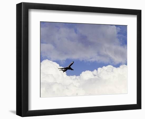 Commercial Airplane Soaring Above the Clouds-Mitch Diamond-Framed Photographic Print