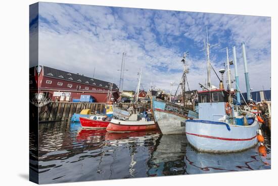 Commercial Fishing and Whaling Boats Line the Busy Inner Harbor in the Town of Ilulissat-Michael-Stretched Canvas