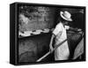 Communal Bakery in Primitive Mexican Village, Loaves of Bread Being Shoved into Adobe Oven-null-Framed Stretched Canvas