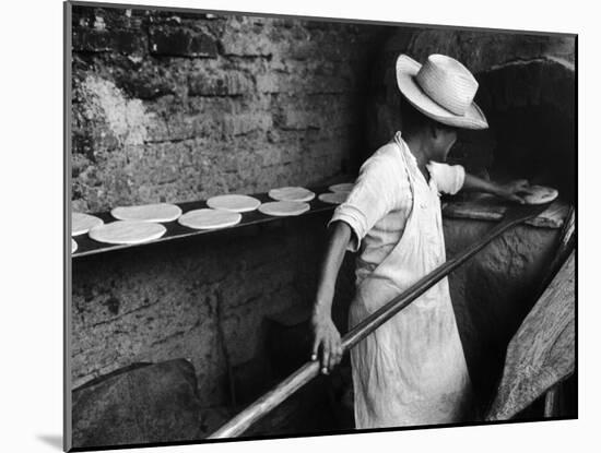 Communal Bakery in Primitive Mexican Village, Loaves of Bread Being Shoved into Adobe Oven-null-Mounted Premium Photographic Print
