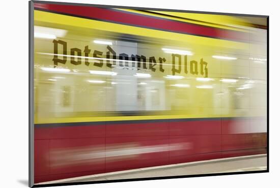 Commuter Train Speeding through Potsdamer Platz U-Bahn Station-Jon Hicks-Mounted Photographic Print