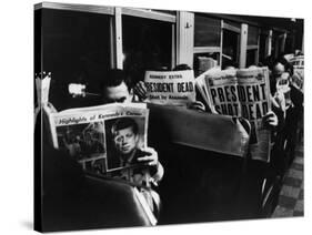 Commuters Reading of John F. Kennedy's Assassination-Carl Mydans-Stretched Canvas