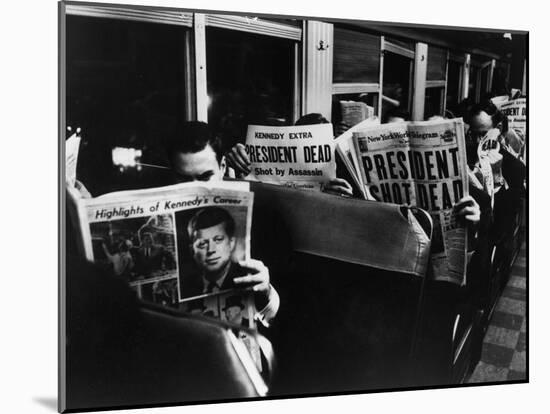 Commuters Reading of John F. Kennedy's Assassination-Carl Mydans-Mounted Photographic Print