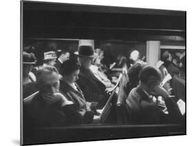 Commuters Reading on the Train-Walter Sanders-Mounted Photographic Print