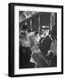 Commuters Sitting on a Train and Reading the Chicago Tribune-Charles E^ Steinheimer-Framed Photographic Print