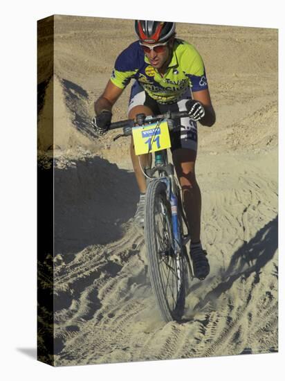 Competitior Riding Uphill on Sandy Track in Mount Sodom International Mountain Bike Race, Israel-Eitan Simanor-Stretched Canvas