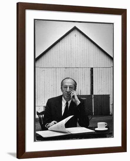 Composer Arron Copland Sitting at Table with Score in Front of Barn-Gordon Parks-Framed Photographic Print