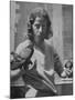 Composer Eden Ahbez Holding Bird in Each Hand-Peter Stackpole-Mounted Premium Photographic Print