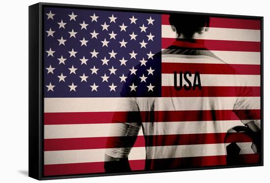 Composite Image of Usa Football Player Holding Ball against Usa National Flag-Wavebreak Media Ltd-Framed Stretched Canvas