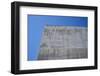 Concrete grey wall with structure and inclusions as a background in front of sky blue cloudless-Axel Killian-Framed Photographic Print