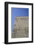 Concrete grey wall with structure and inclusions as a background in front of sky blue cloudless-Axel Killian-Framed Photographic Print