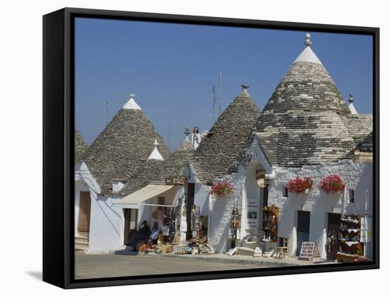 Conical Roofs and Whitewashed Walls of Trullis in Alberobello, Puglia, Italy-Hans Peter Merten-Framed Stretched Canvas