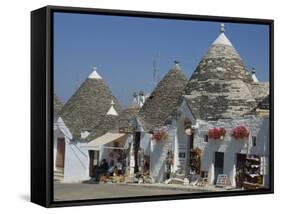 Conical Roofs and Whitewashed Walls of Trullis in Alberobello, Puglia, Italy-Hans Peter Merten-Framed Stretched Canvas