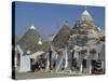 Conical Roofs and Whitewashed Walls of Trullis in Alberobello, Puglia, Italy-Hans Peter Merten-Stretched Canvas