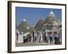 Conical Roofs and Whitewashed Walls of Trullis in Alberobello, Puglia, Italy-Hans Peter Merten-Framed Photographic Print