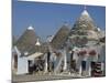 Conical Roofs and Whitewashed Walls of Trullis in Alberobello, Puglia, Italy-Hans Peter Merten-Mounted Photographic Print