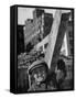 Construction Worker Carrying a Piece of Wood-Cornell Capa-Framed Stretched Canvas