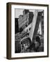 Construction Worker Carrying a Piece of Wood-Cornell Capa-Framed Photographic Print