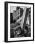 Construction Worker Carrying a Piece of Wood-Cornell Capa-Framed Photographic Print