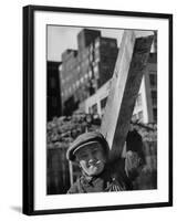 Construction Worker Carrying a Piece of Wood-Cornell Capa-Framed Photographic Print