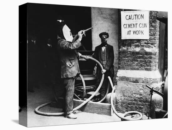 Construction Workers Spraying Cement on Roof with Concrete Gun-null-Stretched Canvas