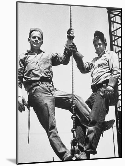 Construction Workers Standing on a Wreaking Ball-Ralph Crane-Mounted Photographic Print