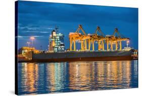 Container Cargo Freight Ship with Working Container Crane in Shipyard at Dusk-Prasit Rodphan-Stretched Canvas