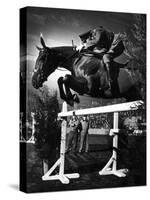 Contestant Jumping at the National Horse Show at Madison Square Garden-Gjon Mili-Stretched Canvas