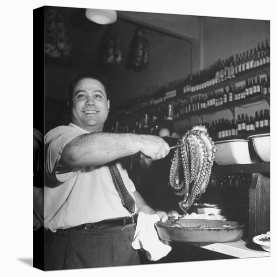 Cook in the Napoli Restaurant Holding up an Octopus, a Delicacy in Argentina-Thomas D^ Mcavoy-Stretched Canvas
