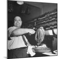 Cook in the Napoli Restaurant Holding up an Octopus, a Delicacy in Argentina-Thomas D^ Mcavoy-Mounted Premium Photographic Print