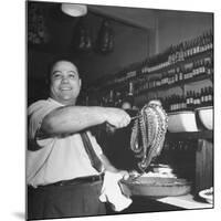 Cook in the Napoli Restaurant Holding up an Octopus, a Delicacy in Argentina-Thomas D^ Mcavoy-Mounted Photographic Print