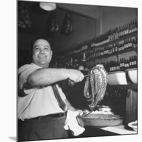 Cook in the Napoli Restaurant Holding up an Octopus, a Delicacy in Argentina-Thomas D^ Mcavoy-Mounted Photographic Print