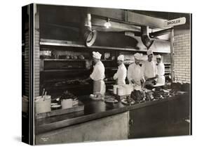 Cooks at the Broiler in the Kitchen of the Hotel Commodore, 1919-Byron Company-Stretched Canvas