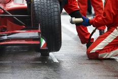 Professional Racing Team at Work during a Pitstop of a Race Car in the Pitslane during a Car Race.-Corepics VOF-Photographic Print