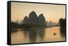 Cormorant Fisherman on Li River at Dusk, Xingping, Yangshuo, Guangxi, China-Ian Trower-Framed Stretched Canvas