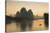 Cormorant Fisherman on Li River at Dusk, Xingping, Yangshuo, Guangxi, China-Ian Trower-Stretched Canvas