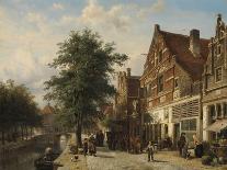 Canal Beside a Cobblestoned Street with Peasants-Cornelis Springer-Framed Art Print