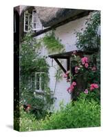 Cottage and Flowers, Wherwell, Hampshire, England, United Kingdom-Jean Brooks-Stretched Canvas