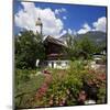 Cottage Garden at Polznkaspar House with Parish Church of St. Martin-null-Mounted Art Print