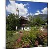 Cottage Garden at Polznkaspar House with Parish Church of St. Martin-null-Mounted Art Print