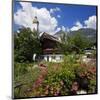 Cottage Garden at Polznkaspar House with Parish Church of St. Martin-null-Mounted Art Print