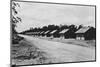 Cottages Lining Dirt Road-null-Mounted Photographic Print
