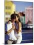 Couple at the Willemstad Waterfront, Curacao, Caribbean-Greg Johnston-Mounted Photographic Print