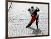 Couple dancing Tango on cobblestone road-null-Framed Art Print