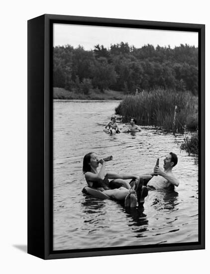 Couple Drinking Beer at Inner Tube Floating Party on the Apple River-Alfred Eisenstaedt-Framed Stretched Canvas