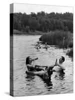 Couple Drinking Beer at Inner Tube Floating Party on the Apple River-Alfred Eisenstaedt-Stretched Canvas